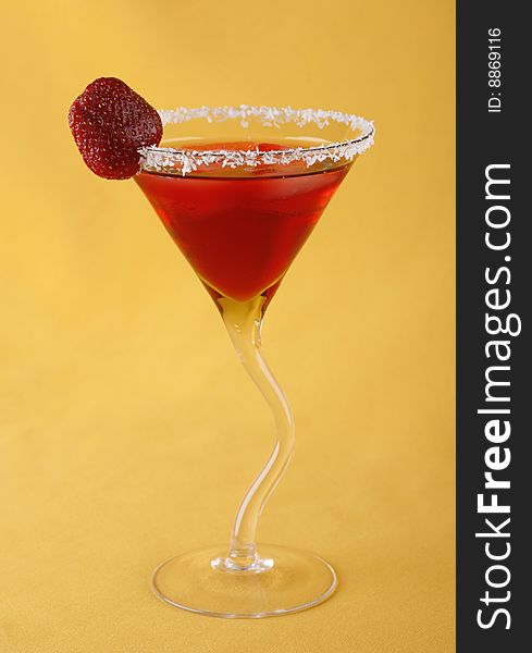 Alcoholic cocktail with strawberry liquor background the yellow. Alcoholic cocktail with strawberry liquor background the yellow