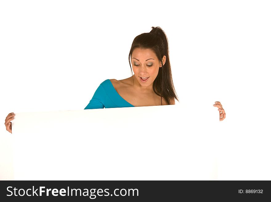 Young caucasian brunette holding a blank panel with surprised facial expression isolated on white,wearing casual clothes.Concept of advertising. Young caucasian brunette holding a blank panel with surprised facial expression isolated on white,wearing casual clothes.Concept of advertising