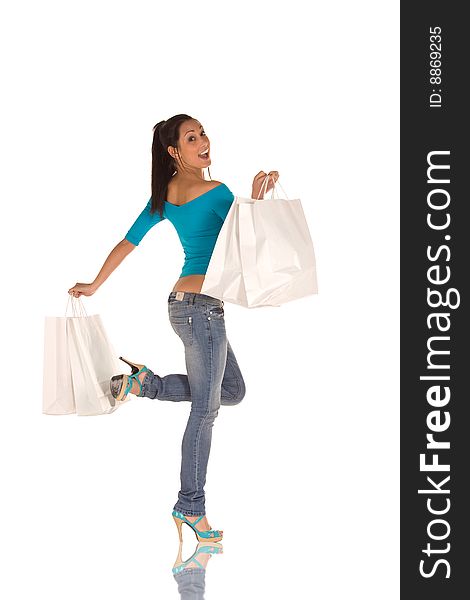 Young caucasian brunette with a bunch of white shopping bags,isolated on white,with happy expression. Young caucasian brunette with a bunch of white shopping bags,isolated on white,with happy expression.