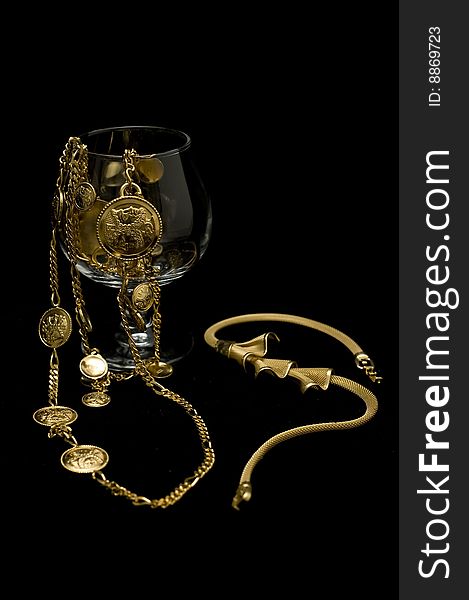 Costume jewelery placed on isolated black background