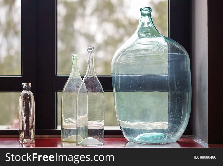 Glass bottles on the window. Glass bottles on the window