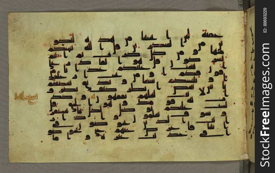 This horizontal-format manuscript on parchment is an illuminated fragment of the Qur&#x27;an, covering chapter 6 &#x28;Sūrat al-anʿām&#x29;, the end of verse 54, through chapter 9 &#x28;Sūrat al-tawbah&#x29;, verse 79. The fragment probably dates to the third century AH / ninth CE. The text is written in an Early Abbasid &#x28;Kufic&#x29; script in dark brown ink and vocalized with red dots. Chapter headings are in gold ink, and verse markers in the shape of a stylized letter hā&#x27; and rosettes with colored dots indicate groups of five and ten verses. The green goatskin binding with gold-painted central floral design and cornerpieces is thirteenth century AH / nineteenth CE or later. See this manuscript page by page at the Walters Museum Website: art.thewalters.org/viewwoa.aspx?id=1528. This horizontal-format manuscript on parchment is an illuminated fragment of the Qur&#x27;an, covering chapter 6 &#x28;Sūrat al-anʿām&#x29;, the end of verse 54, through chapter 9 &#x28;Sūrat al-tawbah&#x29;, verse 79. The fragment probably dates to the third century AH / ninth CE. The text is written in an Early Abbasid &#x28;Kufic&#x29; script in dark brown ink and vocalized with red dots. Chapter headings are in gold ink, and verse markers in the shape of a stylized letter hā&#x27; and rosettes with colored dots indicate groups of five and ten verses. The green goatskin binding with gold-painted central floral design and cornerpieces is thirteenth century AH / nineteenth CE or later. See this manuscript page by page at the Walters Museum Website: art.thewalters.org/viewwoa.aspx?id=1528