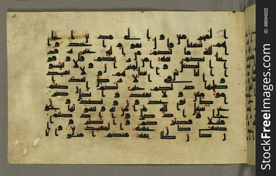 This horizontal-format manuscript on parchment is an illuminated fragment of the Qur&#x27;an, covering chapter 6 &#x28;Sūrat al-anʿām&#x29;, the end of verse 54, through chapter 9 &#x28;Sūrat al-tawbah&#x29;, verse 79. The fragment probably dates to the third century AH / ninth CE. The text is written in an Early Abbasid &#x28;Kufic&#x29; script in dark brown ink and vocalized with red dots. Chapter headings are in gold ink, and verse markers in the shape of a stylized letter hā&#x27; and rosettes with colored dots indicate groups of five and ten verses. The green goatskin binding with gold-painted central floral design and cornerpieces is thirteenth century AH / nineteenth CE or later. See this manuscript page by page at the Walters Museum Website: art.thewalters.org/viewwoa.aspx?id=1528. This horizontal-format manuscript on parchment is an illuminated fragment of the Qur&#x27;an, covering chapter 6 &#x28;Sūrat al-anʿām&#x29;, the end of verse 54, through chapter 9 &#x28;Sūrat al-tawbah&#x29;, verse 79. The fragment probably dates to the third century AH / ninth CE. The text is written in an Early Abbasid &#x28;Kufic&#x29; script in dark brown ink and vocalized with red dots. Chapter headings are in gold ink, and verse markers in the shape of a stylized letter hā&#x27; and rosettes with colored dots indicate groups of five and ten verses. The green goatskin binding with gold-painted central floral design and cornerpieces is thirteenth century AH / nineteenth CE or later. See this manuscript page by page at the Walters Museum Website: art.thewalters.org/viewwoa.aspx?id=1528