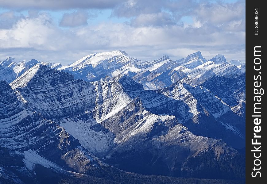 A mountain range with snow-capped peaks. A mountain range with snow-capped peaks.
