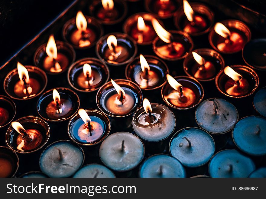 A background of burning and extinct candles. A background of burning and extinct candles.
