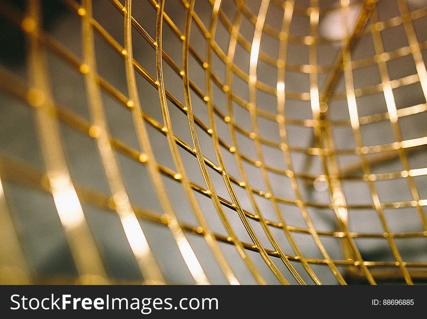 A close up of a golden mesh. A close up of a golden mesh.