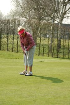Female Golfer Putting Royalty Free Stock Image Female Golfer Putting Royalty Free Stock Image