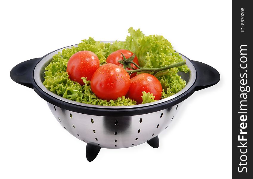 Red Tomato with lettuce isolated on white with clipping path.