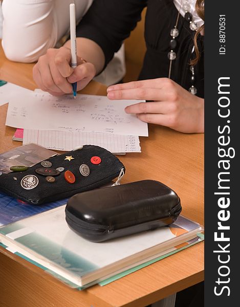 Female hands on a desk.