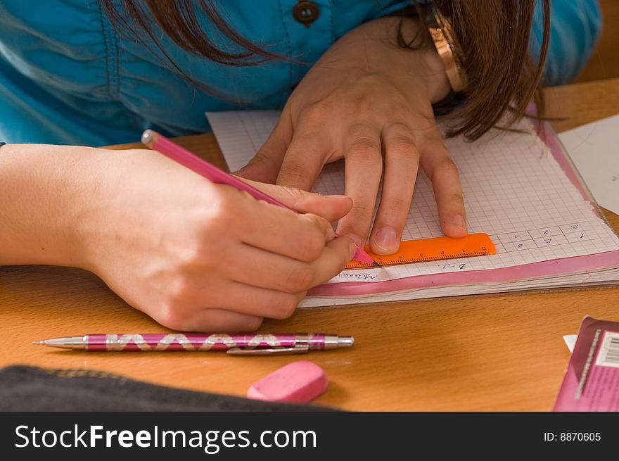 Female Hands On A Desk.