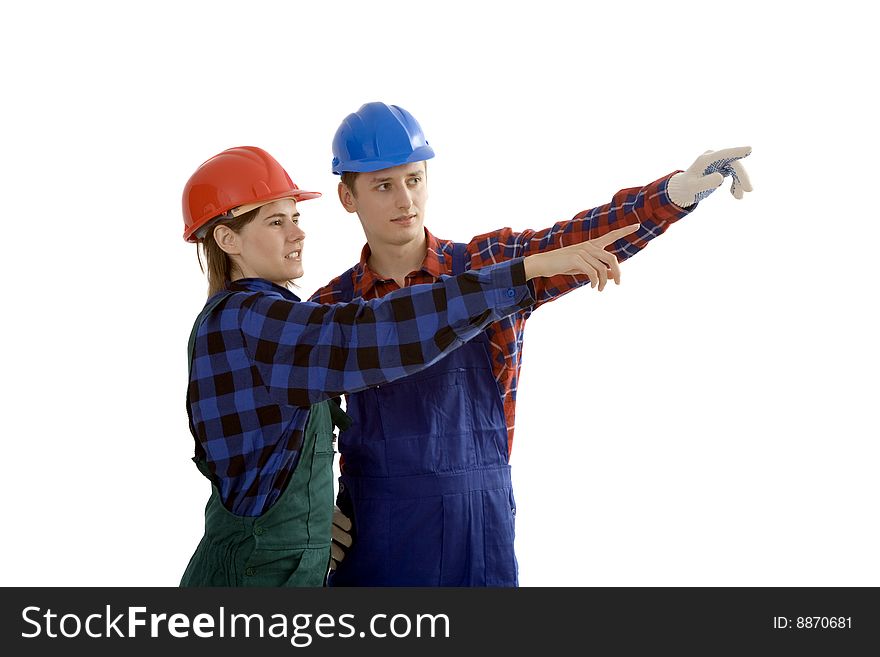 Woman and man in working clothes shows hand direction. Woman and man in working clothes shows hand direction