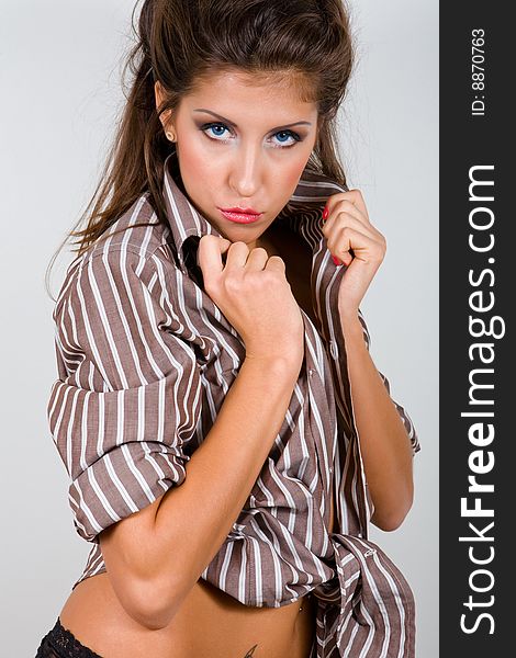 Portrait of attractive young woman in shirt