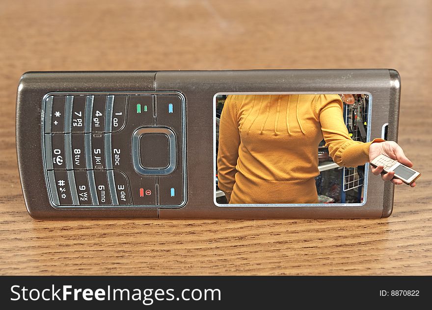 Mobile telephone and woman  hand