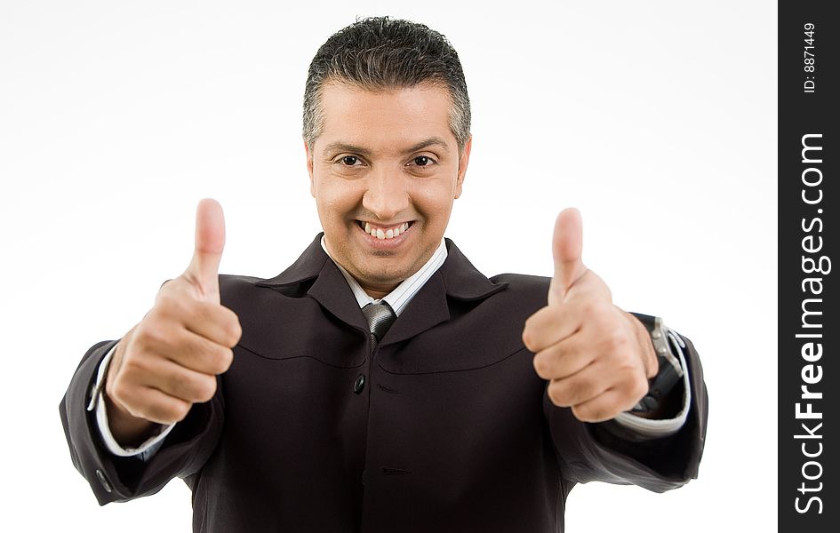 Front view of smiling boss showing thumb up with both hands on an isolated background