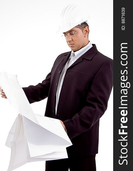 Side view of architect looking the blueprint on white background