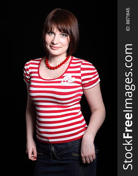 Beautiful young woman in skirt and shirt. With beads. Beautiful young woman in skirt and shirt. With beads