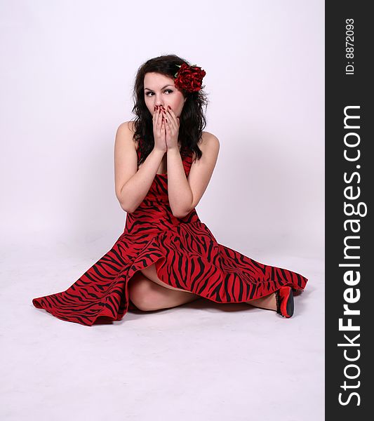 Funny pinup girl sitting in studio