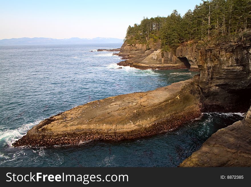 The rocks and caves at Cape Flattery, Washington, the northwestern-most point in the continental U.S. The rocks and caves at Cape Flattery, Washington, the northwestern-most point in the continental U.S.