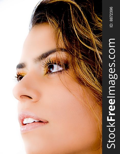 Close up of woman's face looking aside on an isolated white background