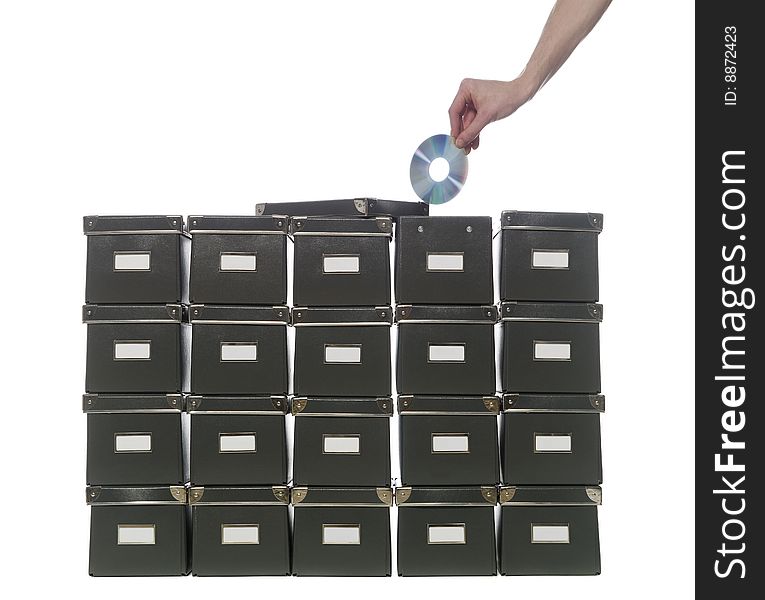 Storage boxes and a hand with a cd