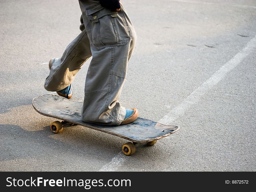 A skateboarder getting ready for a trick