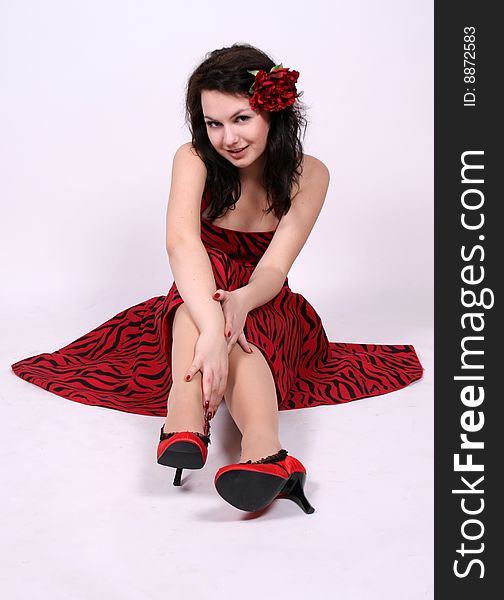 Seductive pinup girl sitting in studio