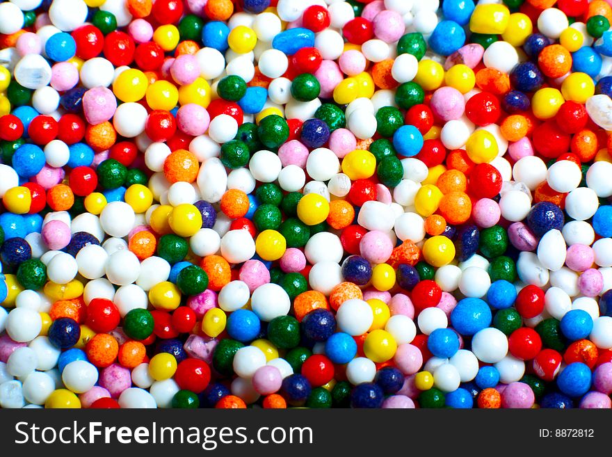 Multi-coloured tasty sweets background. Multi-coloured tasty sweets background
