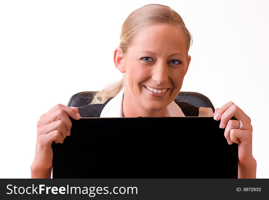 Young woman is looking above a laptop