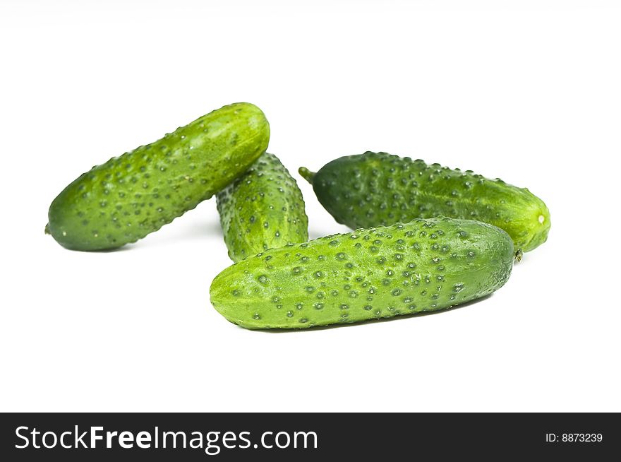 Green cucumber vegetable fruits isolated on white background