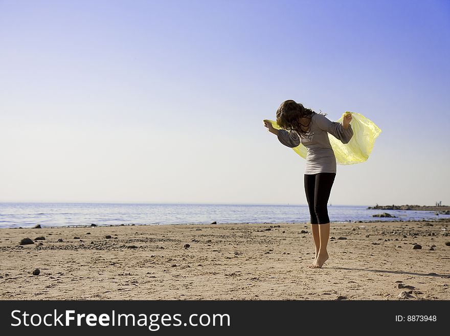 Beautiful brunette girl on the beach