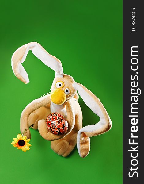 Funny Easter bunny with egg