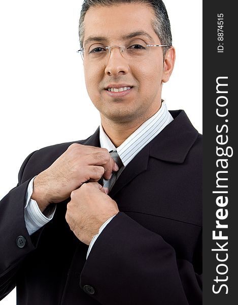 Portrait of CEO holding his tie on an isolated white background