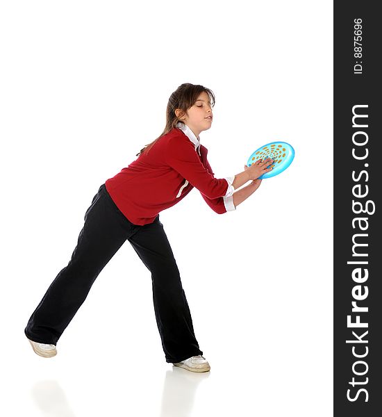 An elementary girl catching a blue frisbee.  Isolated on white. An elementary girl catching a blue frisbee.  Isolated on white.