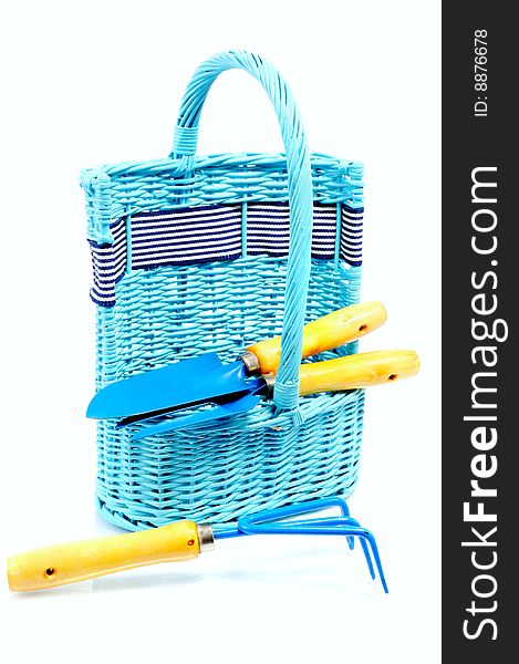 Instrument for garden in basket; isolated on white