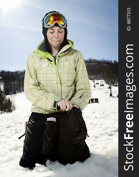 Beautful Girl At Ski Hill Putting On Her Gloves