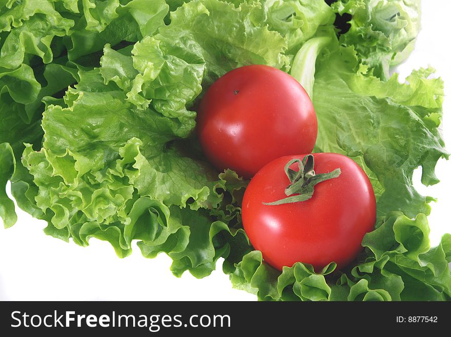 Fresh sheet salad and two red tomatoes. Fresh sheet salad and two red tomatoes.