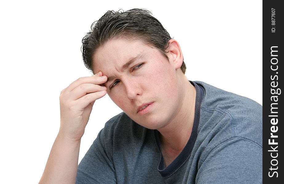 One adult man with a headache or head pain holding his head in worry or anger over white. One adult man with a headache or head pain holding his head in worry or anger over white