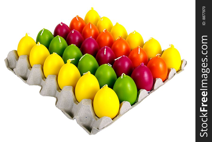 Candles in the form of easter eggs. Beautiful ornaments by a holiday.