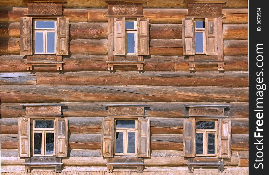 Wooden old wall with windows and jalousie. Wooden old wall with windows and jalousie