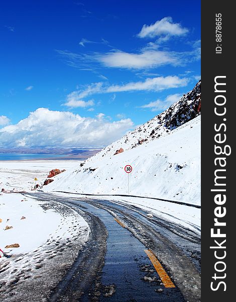 The road to Namtso Lake in the snow of morning.