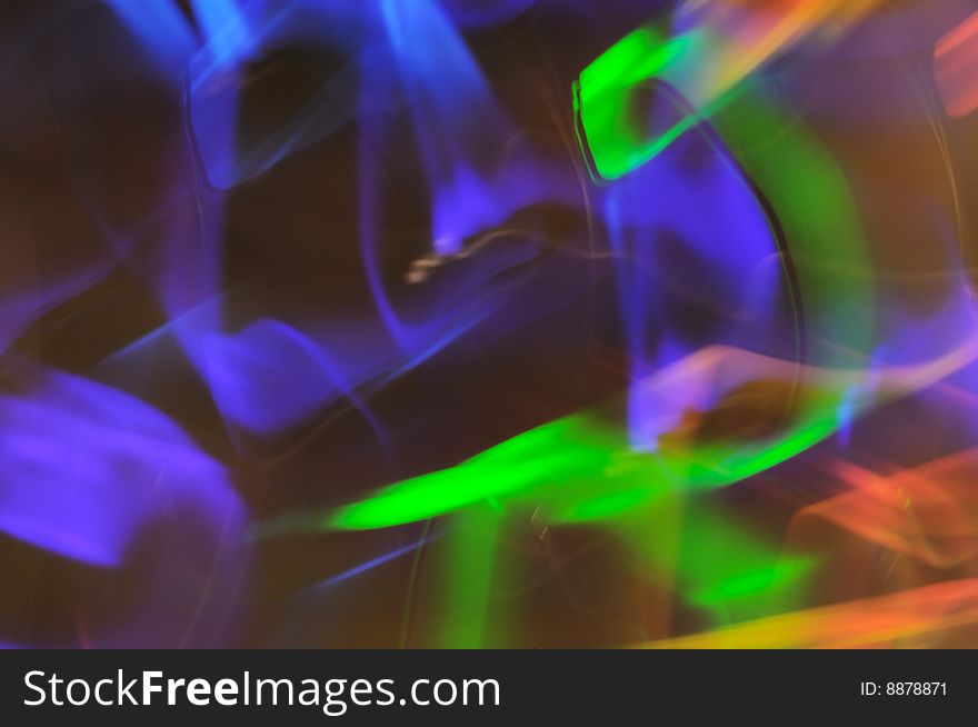Spectrum colored, motion blurred light abstract.