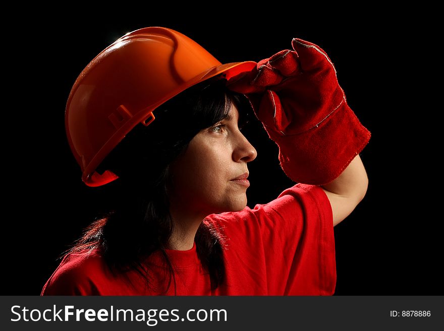 Young woman with helmet, isolated on black