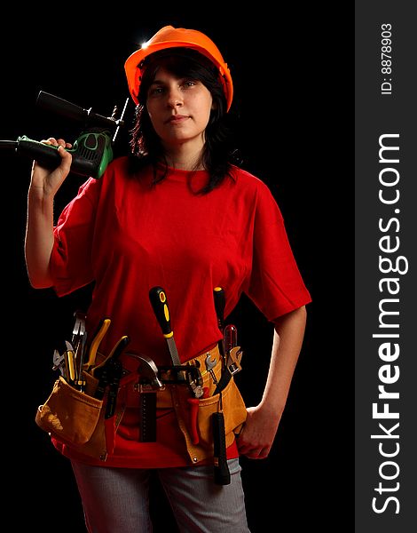 Young Woman With Work Tools And Drill