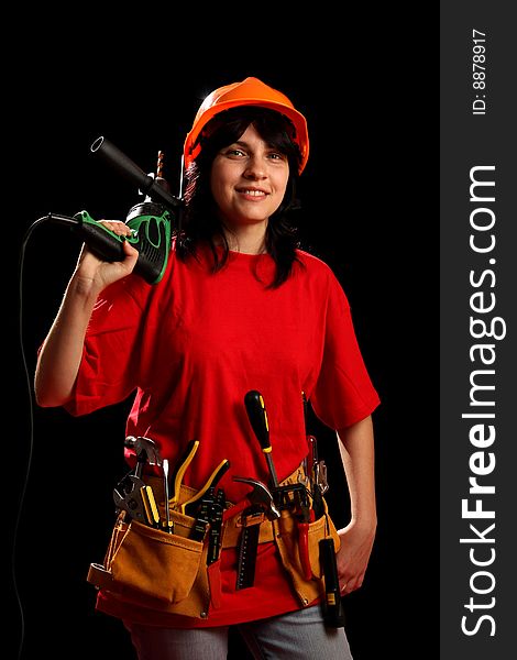 Young woman with work tools, isolated on black. Young woman with work tools, isolated on black
