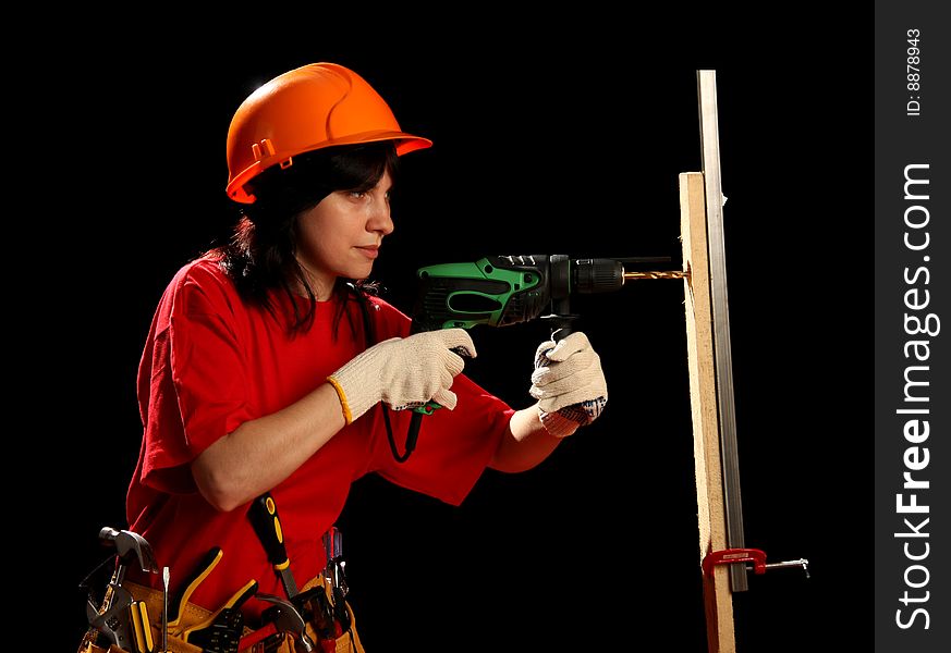 Young woman with work tools and drill