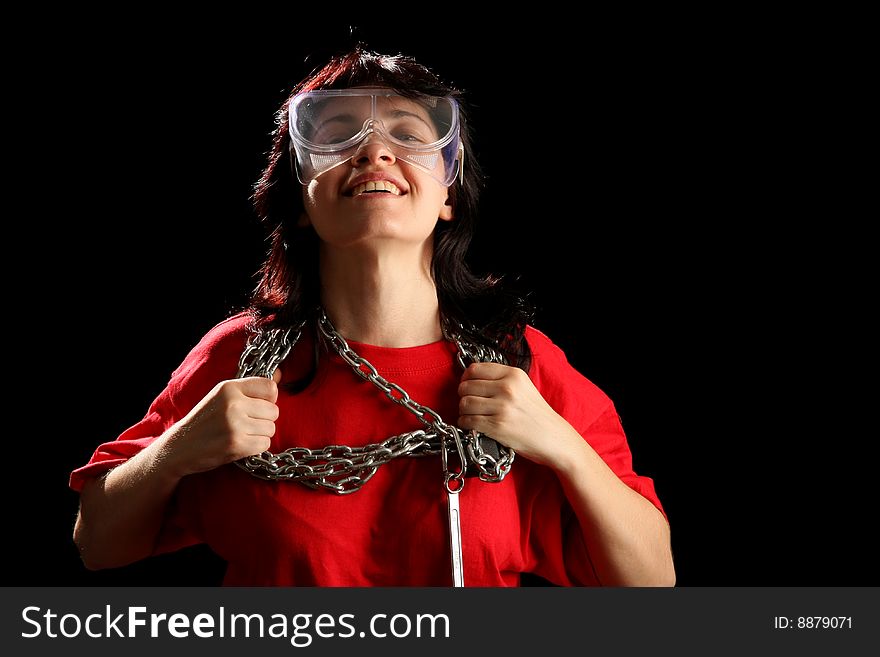 Young woman with chain, isolated on black