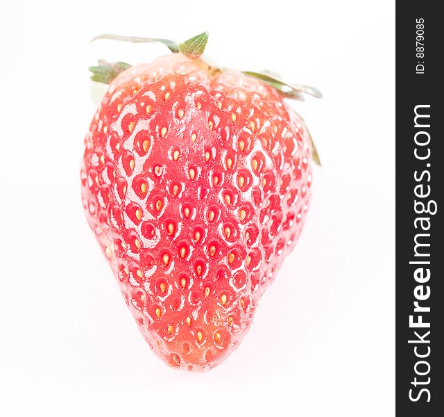 Fresh juicy standing strawberry isolated on white