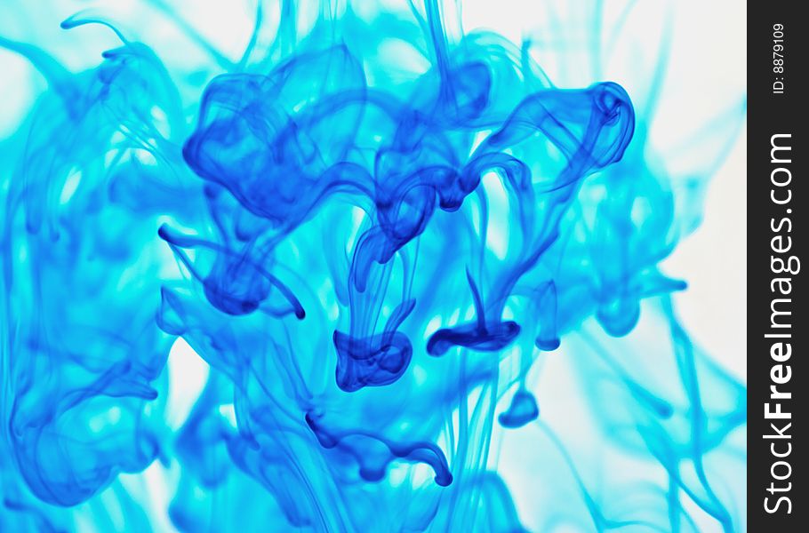 Drops of blue ink in water. Drops of blue ink in water