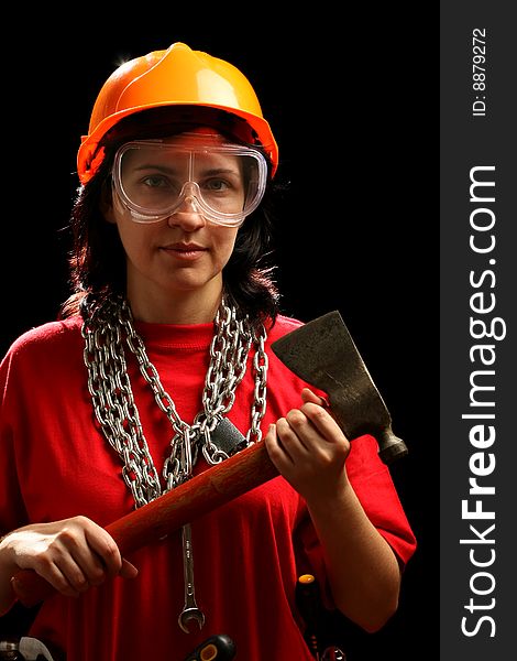 Young woman with chain and axe, isolated on black