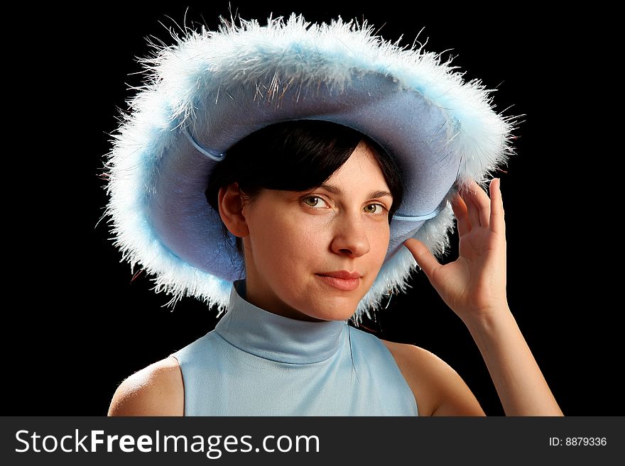 Brunette girl with cowboy hat, isolated on black